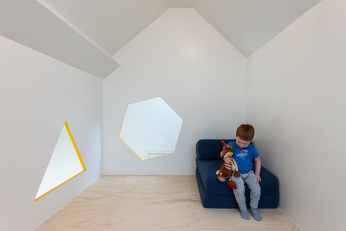 Fun-geometric-shaped-windows-for-the-loft-level-hideaway